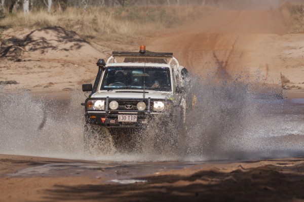 Mine spec vehicle going through shallow water