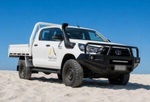 FleetCrew Toyota Hilux Dual Cab Hire Vehicle on the beach